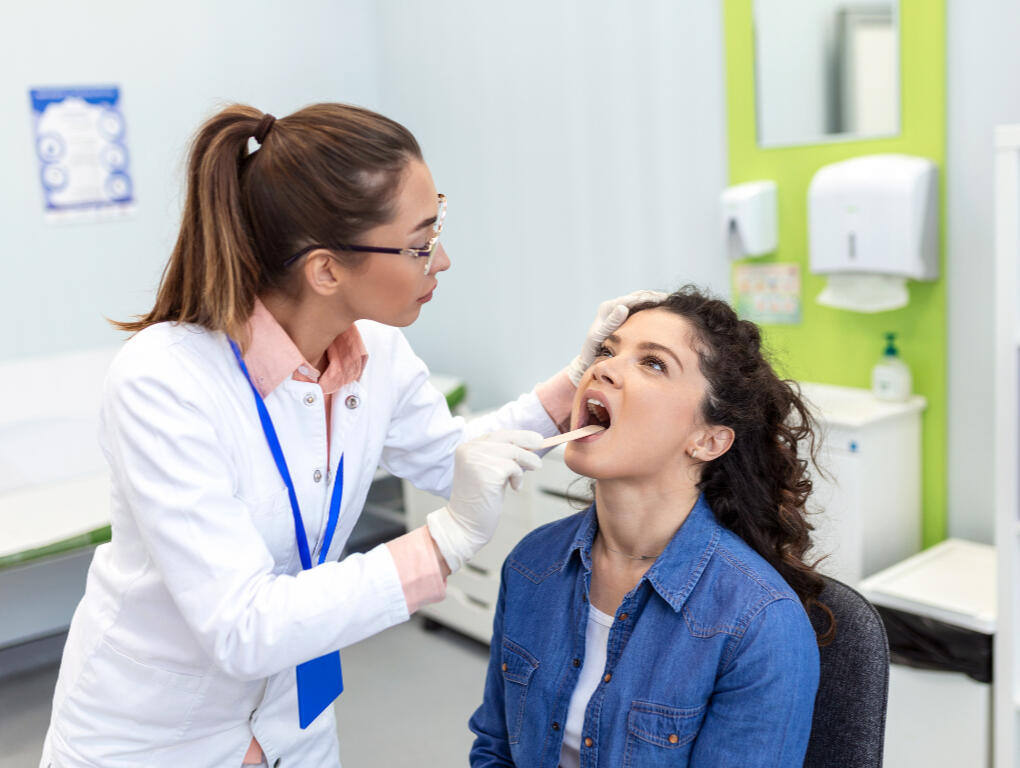 A man taking prescription delivery at the door